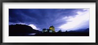 Framed Low Angle View Of A Castle Lit Up At Dusk, Eilean Donan Castle, Highlands, Scotland, United Kingdom