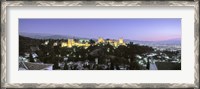 Framed High angle view of a castle lit up at dusk, Alhambra, Granada, Andalusia, Spain