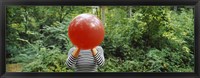 Framed Woman blowing a balloon, Germany