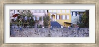 Framed Low Angle View Of A Group Of People Sitting On A Wall, Tubingen, Baden-Wurttemberg, Germany