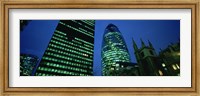 Framed Low angle view of buildings lit up at night, Sir Norman Foster Building, Swiss Re Tower, London, England
