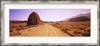 Framed Dirt road passing through an arid landscape, Californian Sierra Nevada, California, USA