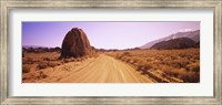 Framed Dirt road passing through an arid landscape, Californian Sierra Nevada, California, USA