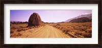 Framed Dirt road passing through an arid landscape, Californian Sierra Nevada, California, USA