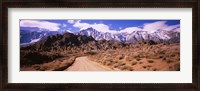 Framed Dirt road passing through an arid landscape, Lone Pine, Californian Sierra Nevada, California, USA