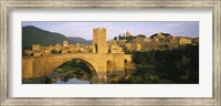 Framed Arch bridge across a river in front of a city, Besalu, Catalonia, Spain