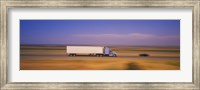 Framed Truck and a car moving on a highway, Highway 5, California, USA