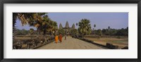 Framed Two monks walking in front of an old temple, Angkor Wat, Siem Reap, Cambodia
