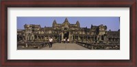 Framed Tourists walking in front of an old temple, Angkor Wat, Siem Reap, Cambodia