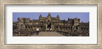 Framed Tourists walking in front of an old temple, Angkor Wat, Siem Reap, Cambodia