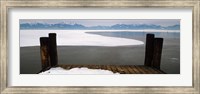 Framed Frozen lake in front of snowcapped mountains, Chiemsee, Bavaria, Germany
