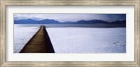 Framed Jetty over a frozen lake, Chiemsee, Bavaria, Germany