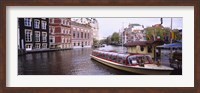 Framed Tourboat in a channel, Amsterdam, Netherlands
