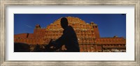 Framed Silhouette of a person riding a motorcycle in front of a palace, Hawa Mahal, Jaipur, Rajasthan, India