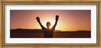 Framed Silhouette of a person wearing boxing gloves in a desert at dusk, Black Rock Desert, Nevada, USA