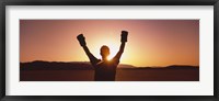 Framed Silhouette of a person wearing boxing gloves in a desert at dusk, Black Rock Desert, Nevada, USA