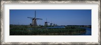 Framed Traditional windmills at a riverbank, Kinderdijk, Rotterdam, Netherlands