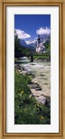 Framed Bridge over stream below country church, Bavarian Alps, Germany.
