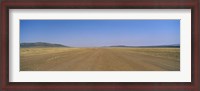 Framed Dirt road passing through a landscape, Masai Mara National Reserve, Great Rift Valley, Kenya