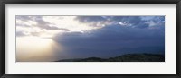 Framed Sunbeams radiating through clouds, Great Rift Valley, Kenya