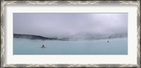 Framed Tourist swimming in a thermal pool, Blue Lagoon, Reykjanes Peninsula, Reykjavik, Iceland