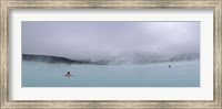 Framed Tourist swimming in a thermal pool, Blue Lagoon, Reykjanes Peninsula, Reykjavik, Iceland