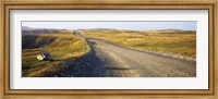 Framed Gravel road passing through a landscape, Cape Bonavista, Newfoundland, Newfoundland and Labrador, Canada