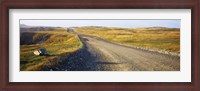Framed Gravel road passing through a landscape, Cape Bonavista, Newfoundland, Newfoundland and Labrador, Canada