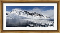 Framed Ice floes on water with a mountain range in the background, Magdalene Fjord, Spitsbergen, Svalbard Islands, Norway