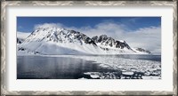 Framed Ice floes on water with a mountain range in the background, Magdalene Fjord, Spitsbergen, Svalbard Islands, Norway