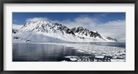 Framed Ice floes on water with a mountain range in the background, Magdalene Fjord, Spitsbergen, Svalbard Islands, Norway