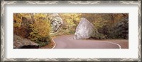 Framed Road curving around a big boulder, Stowe, Lamoille County, Vermont, USA