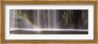 Framed Rainbow formed in front of waterfall in a forest, California, USA