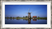Framed Reflection of a traditional windmill in a lake, Netherlands