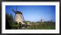 Framed Traditional windmills in a field, Netherlands