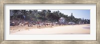 Framed Tourists on the beach, North Shore, Oahu, Hawaii, USA