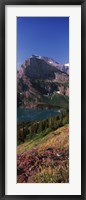Framed Lake near a mountain, US Glacier National Park, Montana, USA