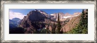 Framed Trees with a mountain range in the background, US Glacier National Park, Montana, USA