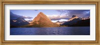 Framed Sunlight falling on mountains at the lakeside, Swiftcurrent Lake, Many Glacier, US Glacier National Park, Montana, USA