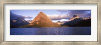 Framed Sunlight falling on mountains at the lakeside, Swiftcurrent Lake, Many Glacier, US Glacier National Park, Montana, USA
