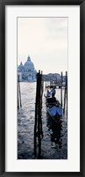 Framed Gondolier in a gondola with a cathedral in the background, Santa Maria Della Salute, Venice, Veneto, Italy