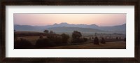 Framed Agricultural field with a mountain range in the background, Transylvania, Romania