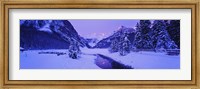 Framed Lake in winter with mountains in the background, Lake Louise, Banff National Park, Alberta, Canada