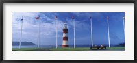 Framed Lighthouse with flags on the coast, Smeaton's Tower, Plymouth Hoe, Plymouth, Devon, England