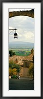 Framed Umbrian countryside viewed through an alleyway, Assisi, Perugia Province, Umbria, Italy