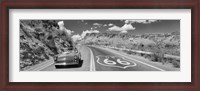 Framed Vintage car moving on Route 66 in black and white, Arizona