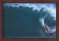 Framed Man surfing in the sea