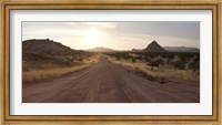 Framed Dirt road passing through a desert, Namibia