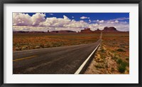 Framed Road passing through a valley, Monument Valley, San Juan County, Utah, USA