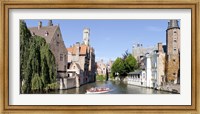 Framed Tourboat in a canal, Bruges, West Flanders, Belgium